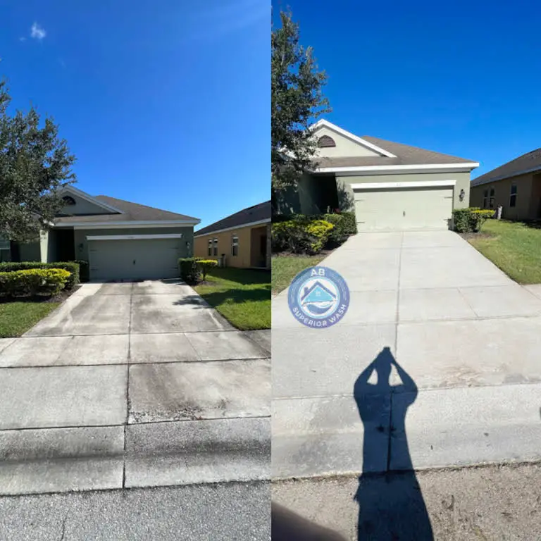 Single-story Orlando home's concrete driveway before and after washing, stains lifted to clean even concrete
