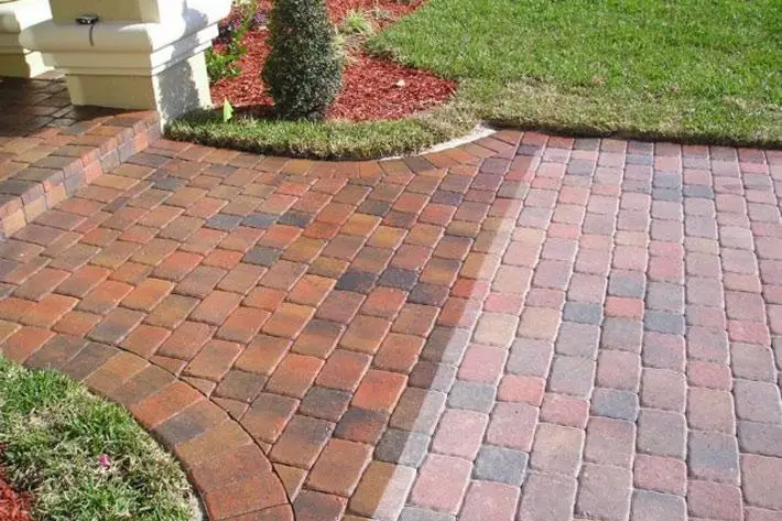 Sealed vs. unsealed pavers in Orlando, FL — the sealed side shows deeper color and a protective wet-look finish applied by AB Superior Wash